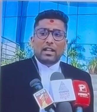 Advocate Karthik M addressing media with TV9 microphones